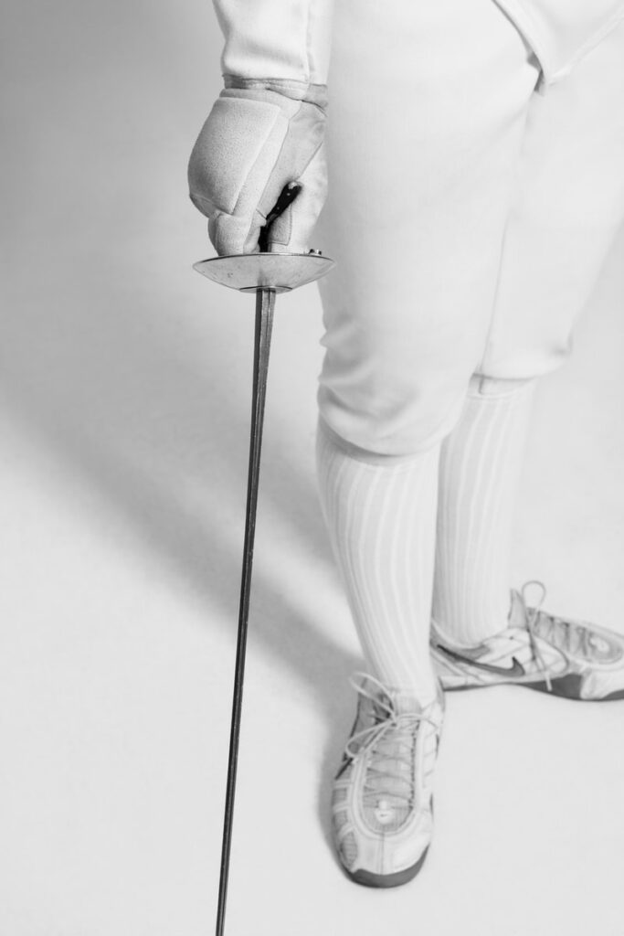 person holding fencing sword